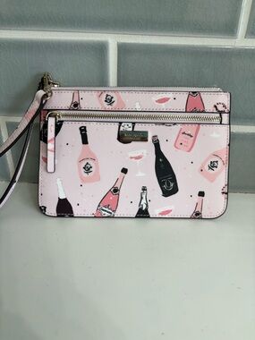 Kate Spade Shore Street Tinie Wristlet in a champagne print.